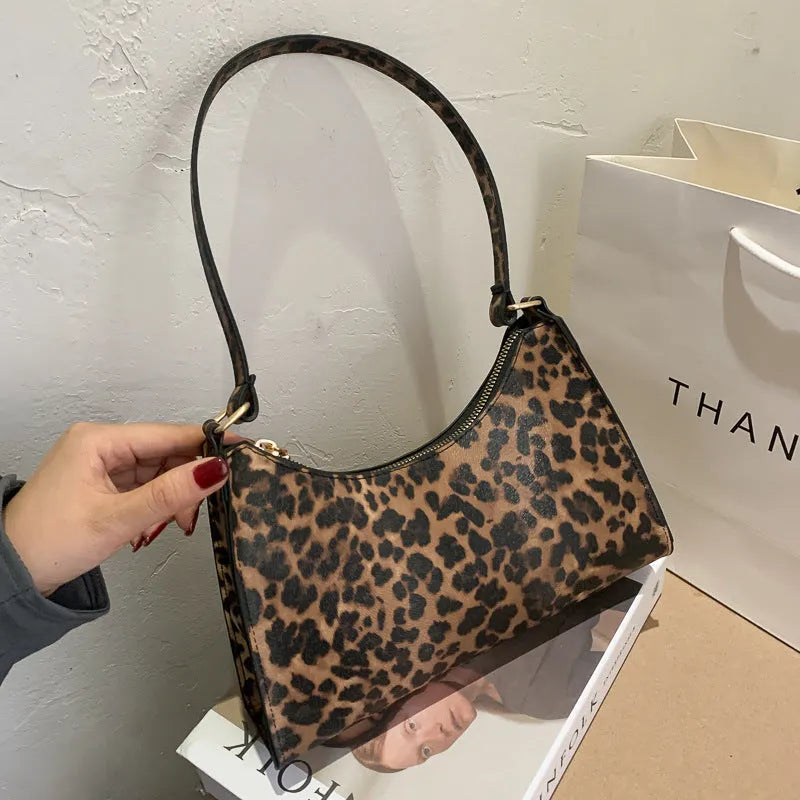 Korean-style small square underarm bag in PU material showing colour options including beige, black and animal prints