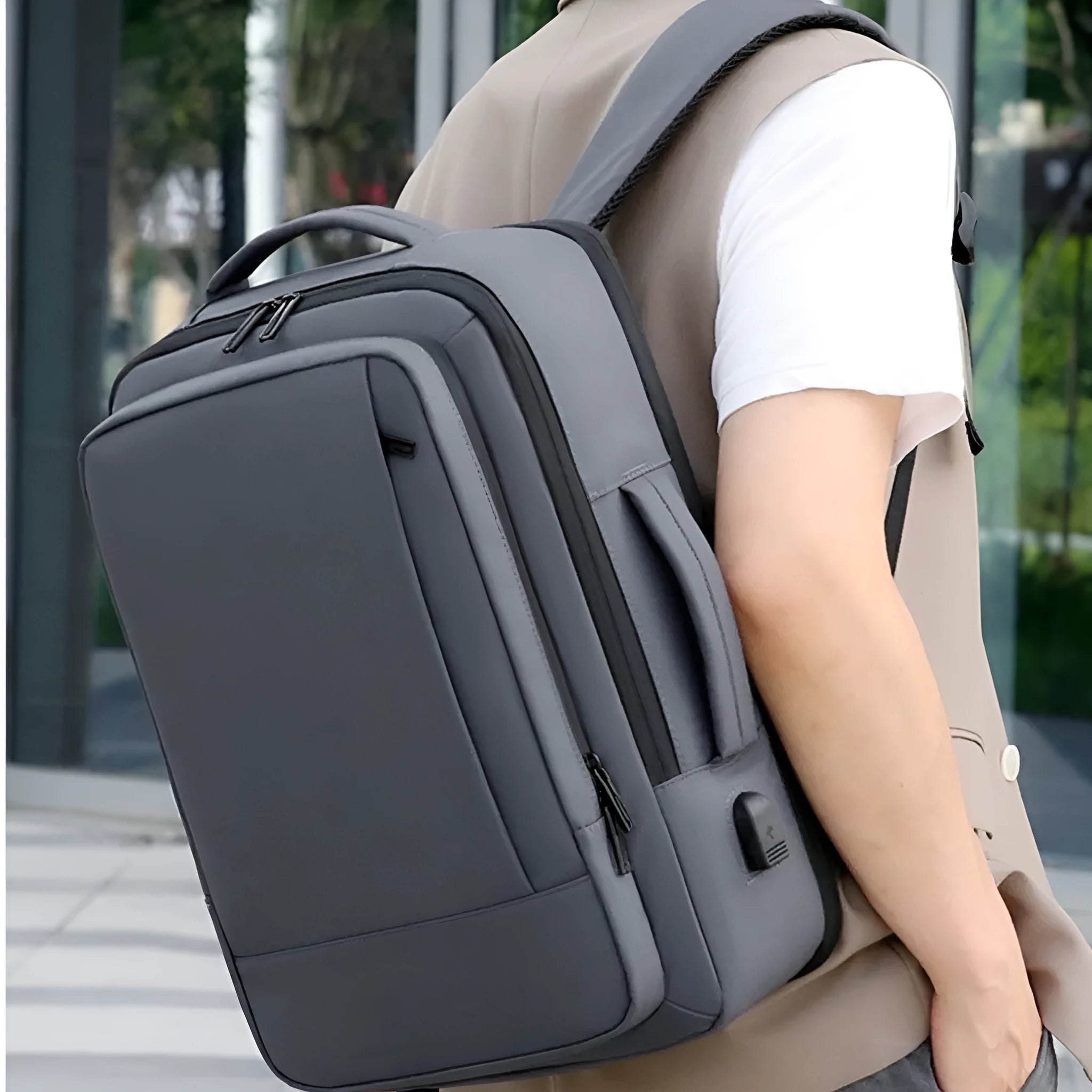Waterproof Oxford cloth backpack with curved shoulder straps showing black and grey colour options