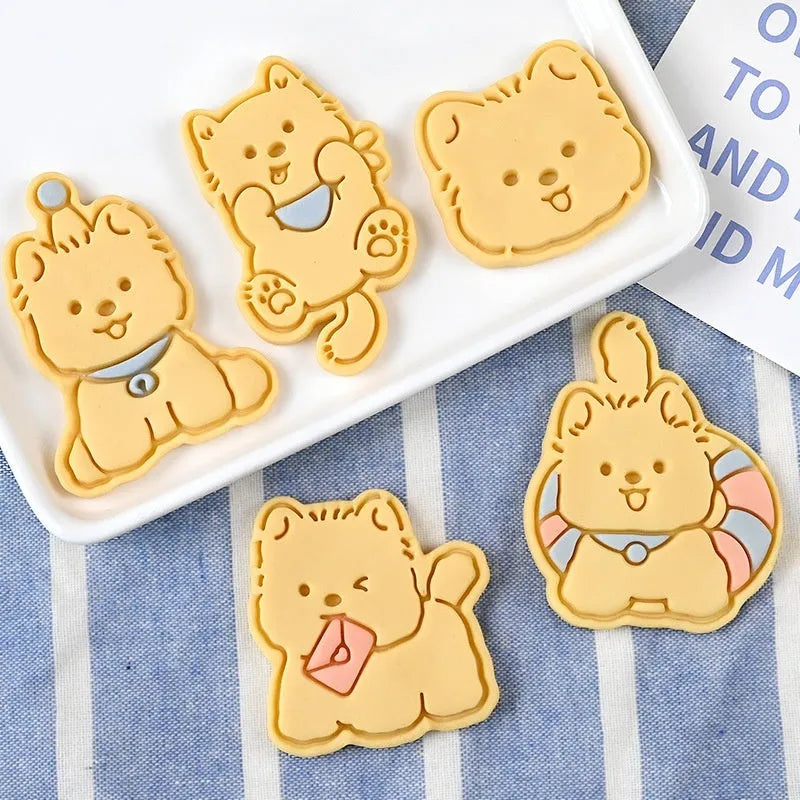 3D plastic biscuit mould with cartoon dog shapes including puppy head and birthday hat