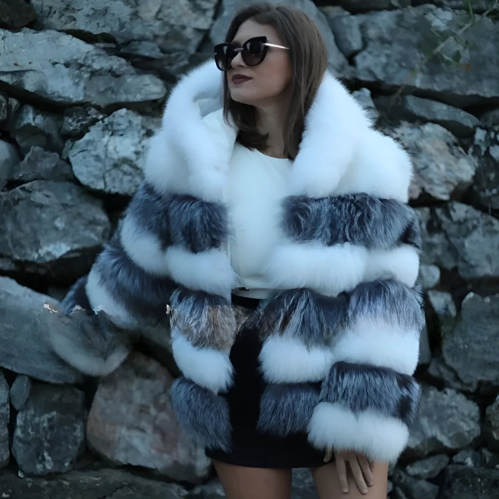 A woman's loose-fitting artificial fur hooded coat in street fashion style.