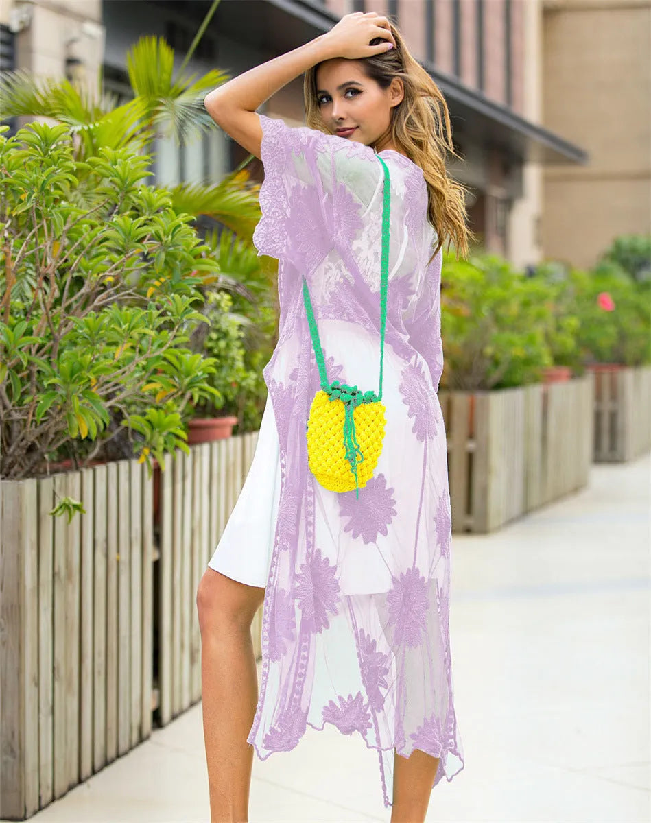 Light purple beach cardigan with lace embroidery detail, shown as beachwear cover-up