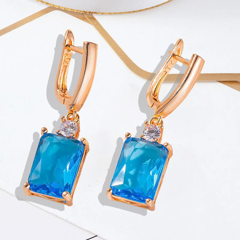 Square geometric copper earrings with electroplated gold finish and quadrilateral design elements