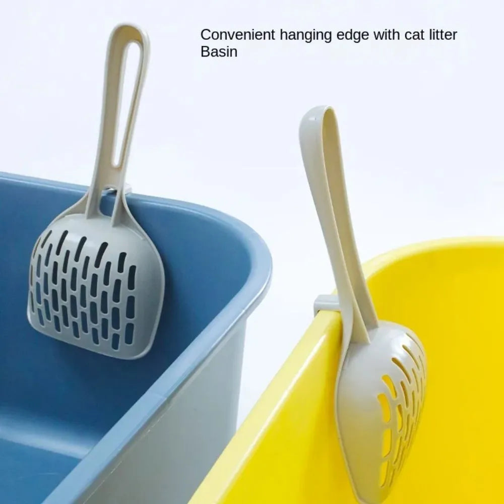 Grey plastic cat litter scoop with an attached stand or base.