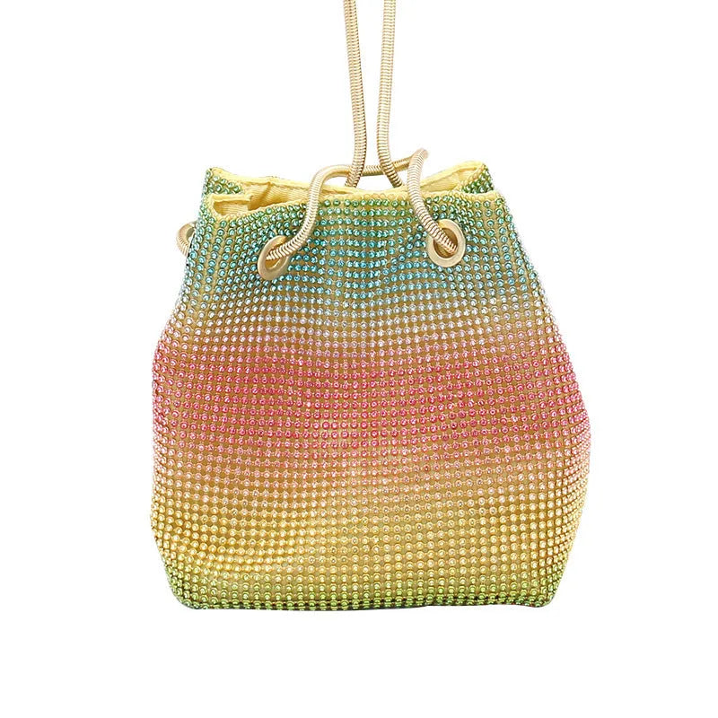 Soft rainbow-coloured rhinestone bucket bag with a silver chain shoulder strap on a white background.