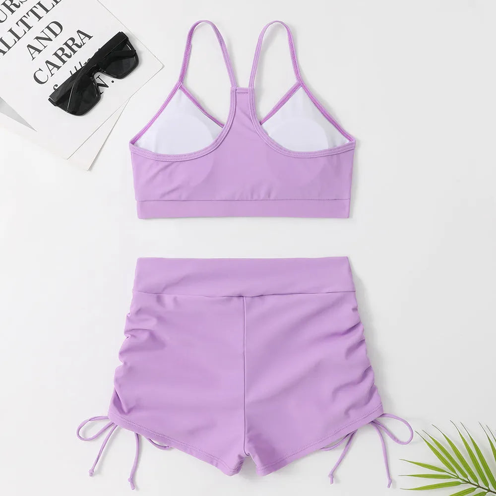 Women's purple high-waist split bikini swimsuit on a mannequin