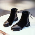 Black women's knee-high soft leather martin boots with side zip and bow detail.