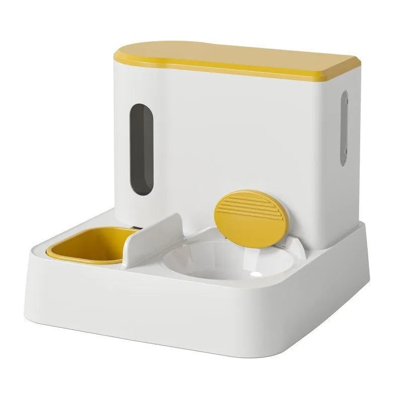 Grey automatic cat feeder and water dispenser station with integrated double bowls on a wooden floor.