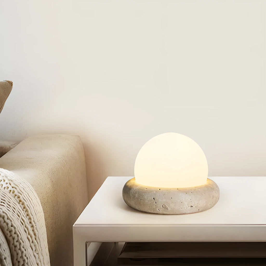 Cream modern bedside remote control night lamp with yellow cave stone light on bedside table