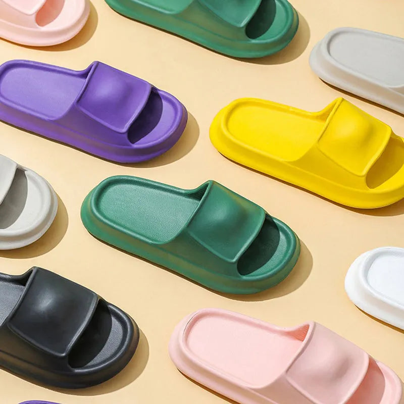 Thick sole EVA flip flop slippers in multiple colours on a white background.