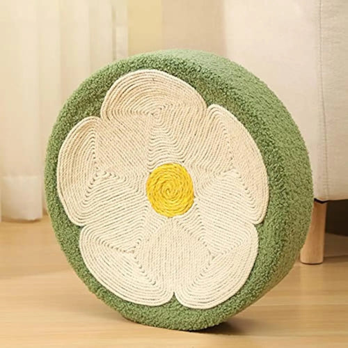 Green round sisal cat scratcher bowl lounge bed for kittens on a floor.