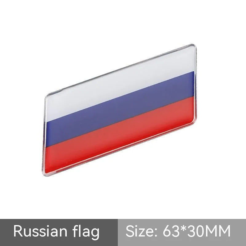 Aluminium parallelogram car sticker with national flag design measuring 6.3 by 3 cm