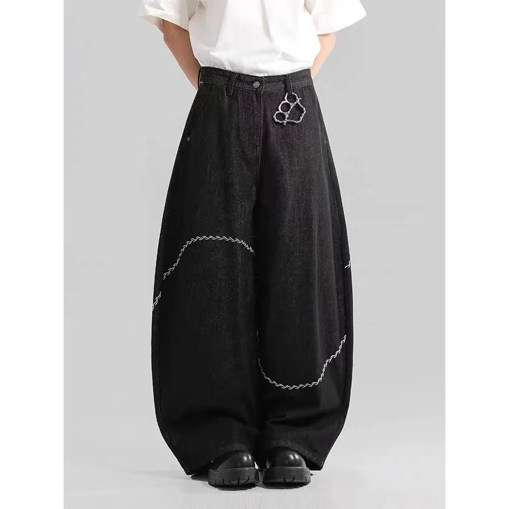 Black straight-leg men's trousers with a mid waist and zip fly, made from micro-elastic denim.