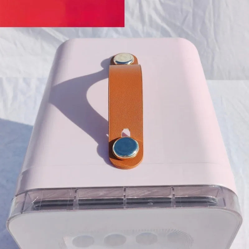 Pink mini refrigerator with transparent door showing internal storage compartments