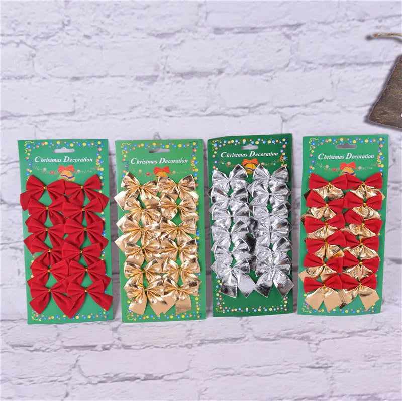 Red and gold 5 cm polyester Christmas decoration bow on a green tree branch.
