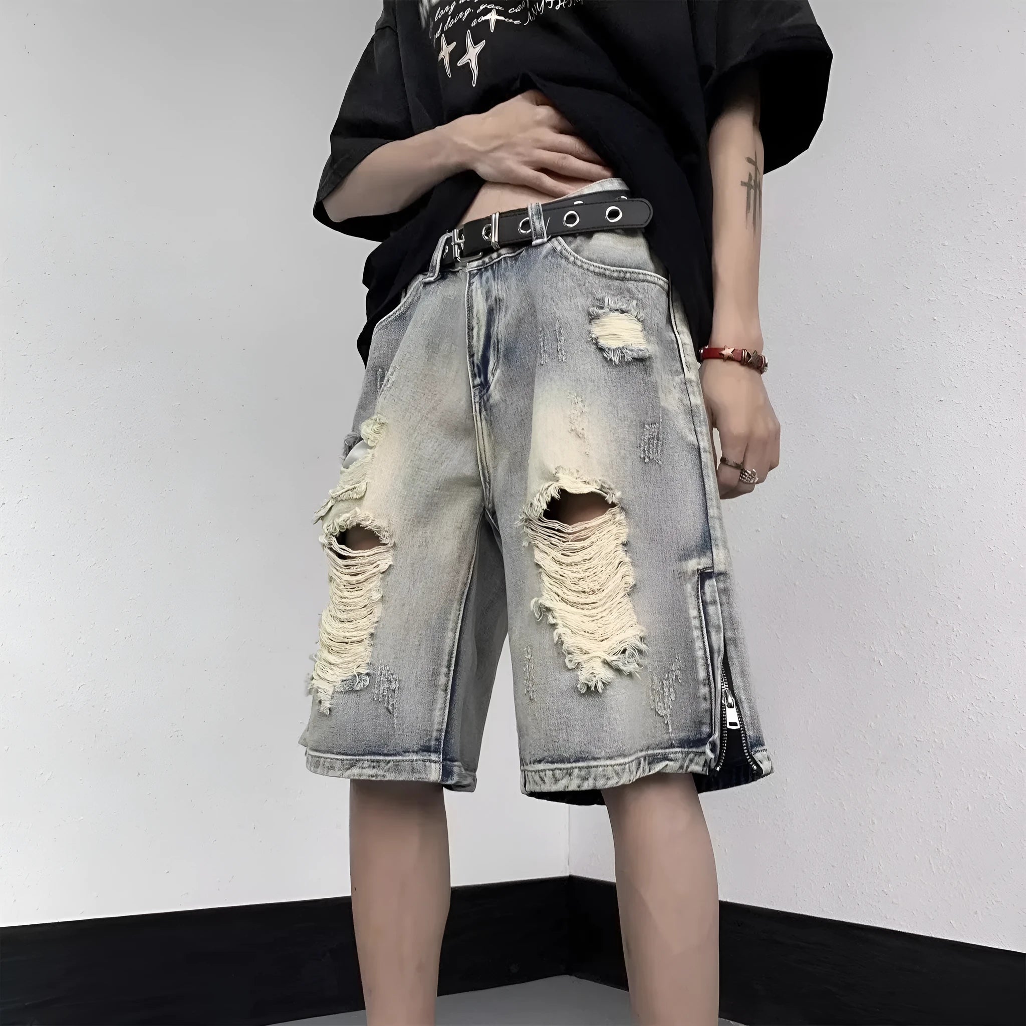 Blue retro denim shorts with wide-leg loose fit and tattered distressing details.
