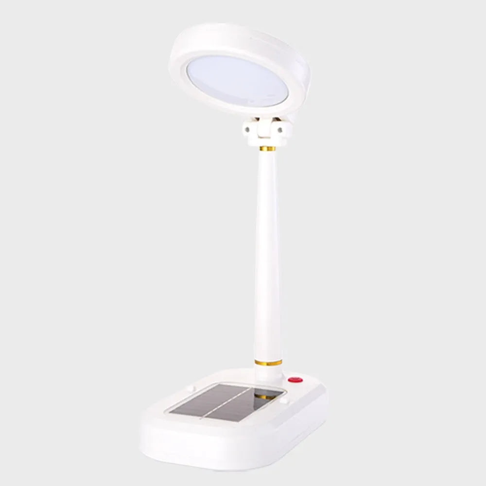 Ivory white solar powered table fan and LED study lamp combination unit on desk