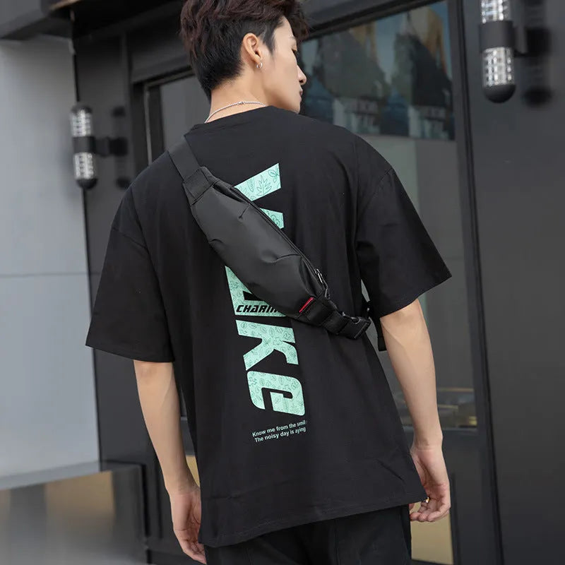 Black oxford cloth men's waist pack showing zipper opening and internal organisation pockets.