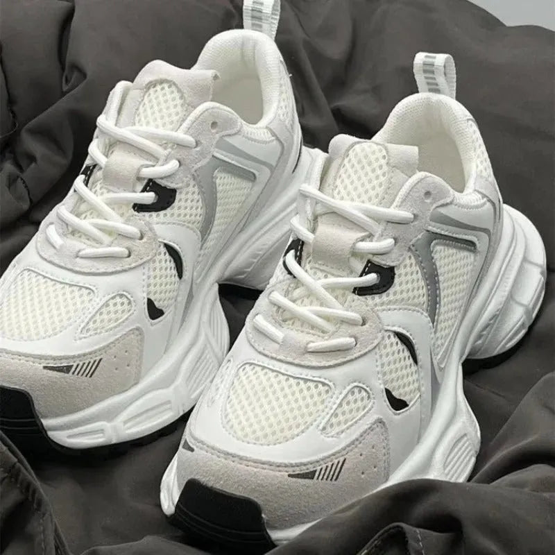 Beige mesh platform sports shoes with wedge muffin heel and lace-up front.