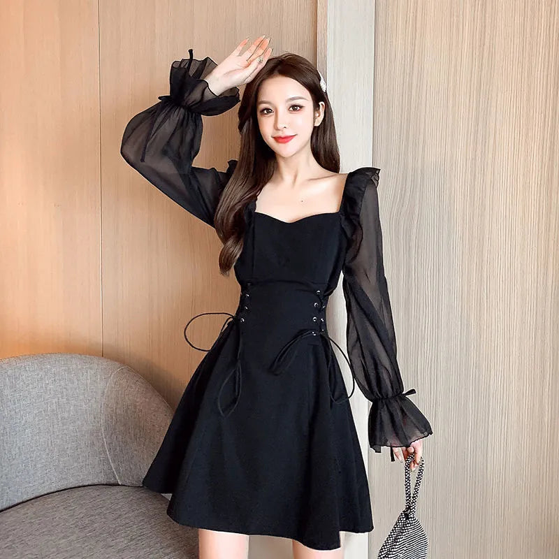 White women's chiffon dress with patchwork pattern and long sleeves, shown in a waist-slimming fit.