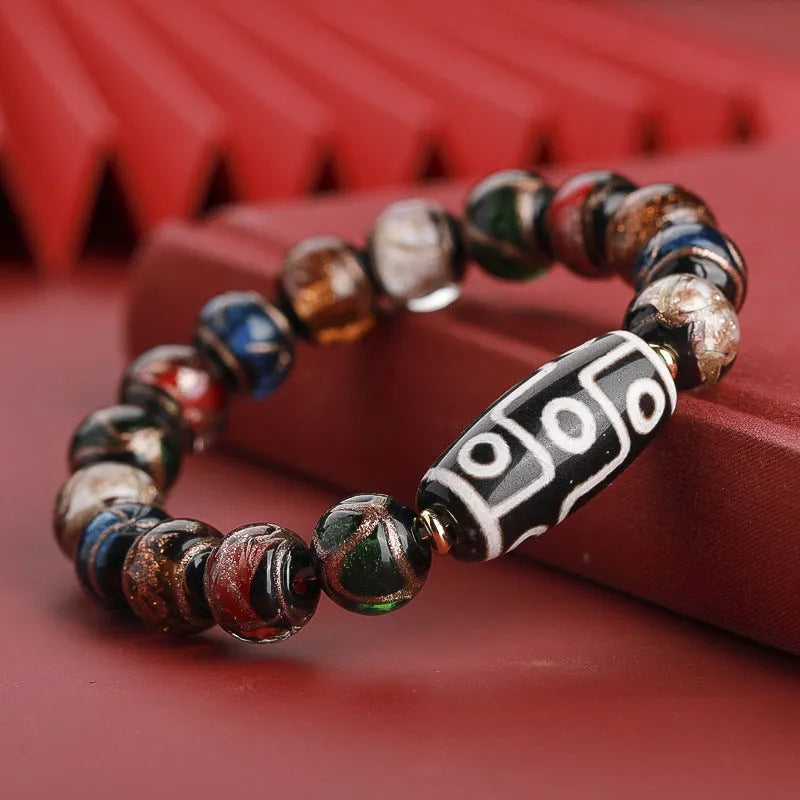 Chinese-style coloured glaze bracelet with five-colour design and Year of the Snake lucky beads.