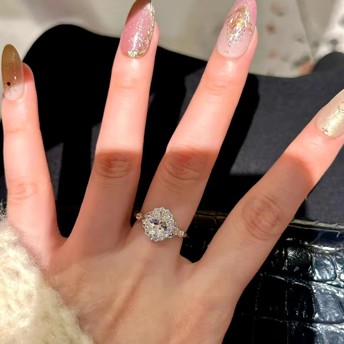 Silver geometric bridal bouquet ring with adjustable opening and diamond-treated elliptical element