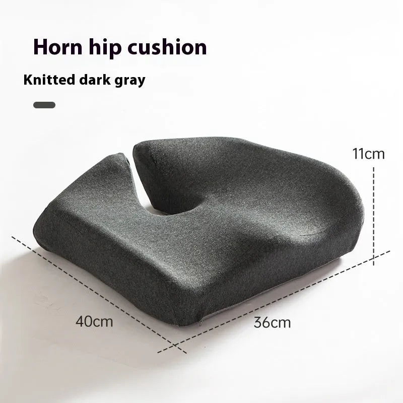 Black memory foam office chair cushion with dimensions 36x40cm on a grey desk chair