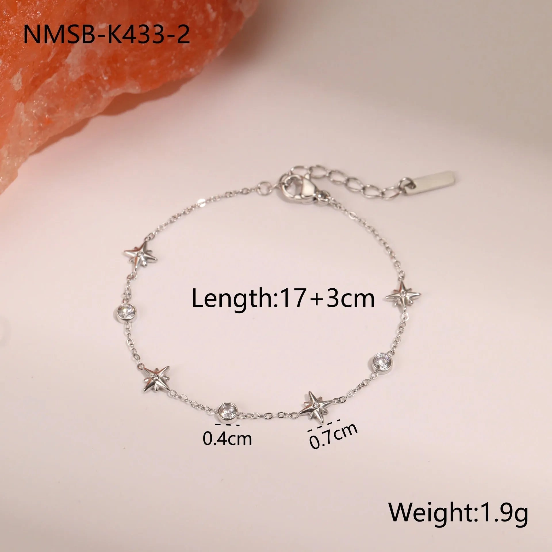 Women's titanium steel bracelet with gold plating and geometric star pendant