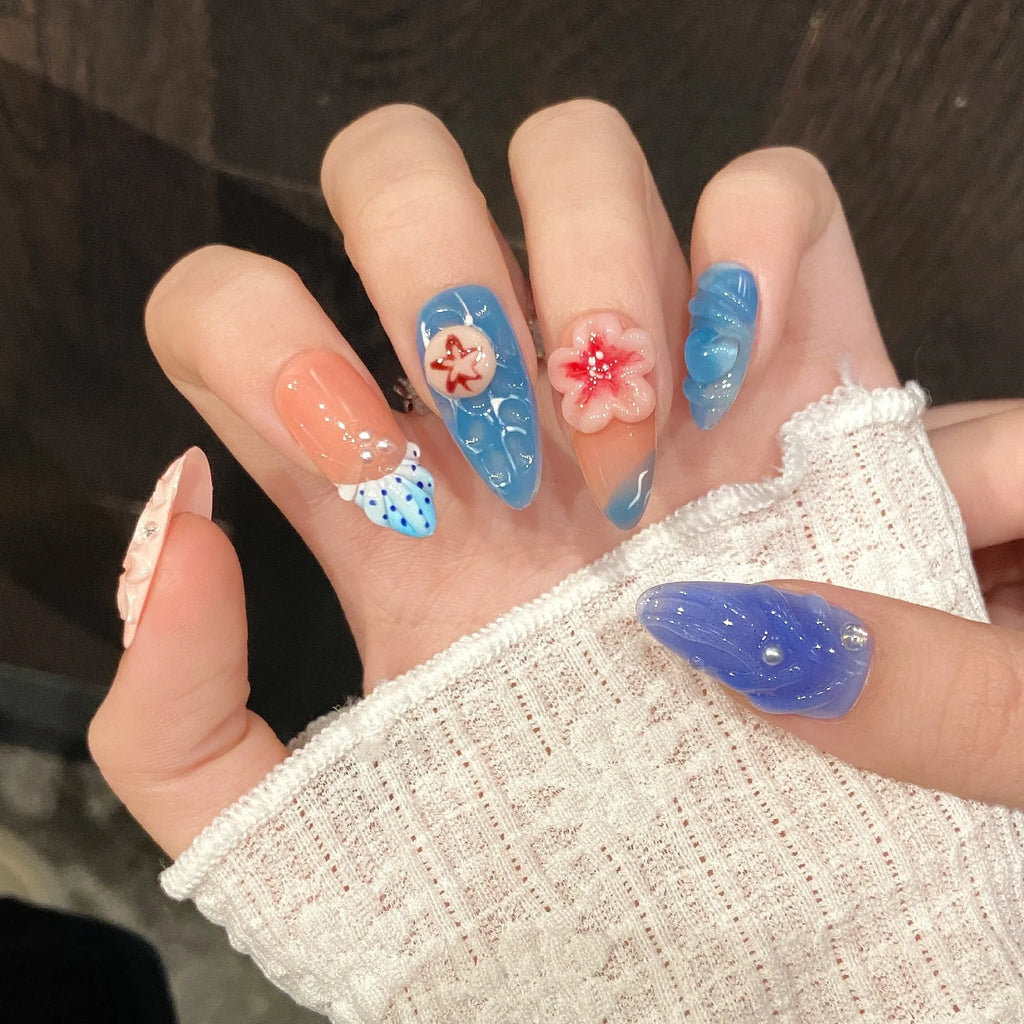 Three-dimensional carved jellyfish marine style wearable armour set in almond nail colour