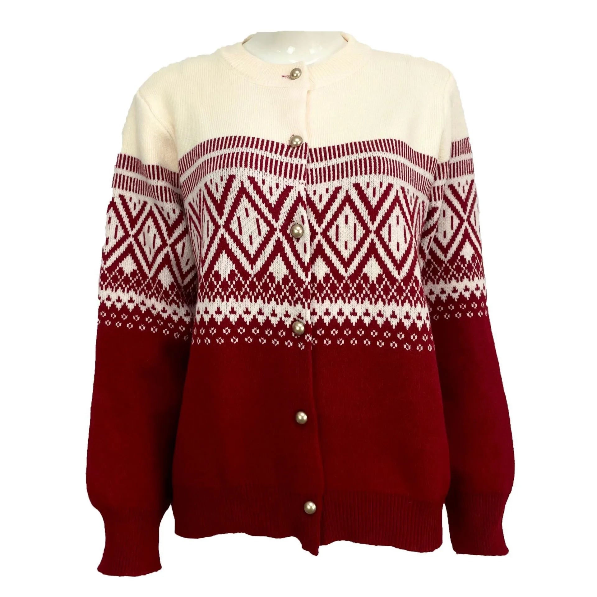 Woman wearing a grey alpaca wool cardigan with a long sleeve diamond pattern in a contrast colour.