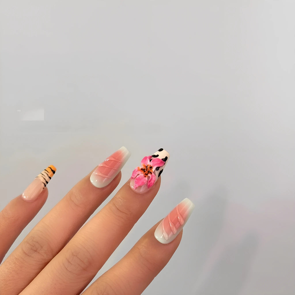 Set of nail art stickers showing zebra pattern and lily flower designs with embossed texture.