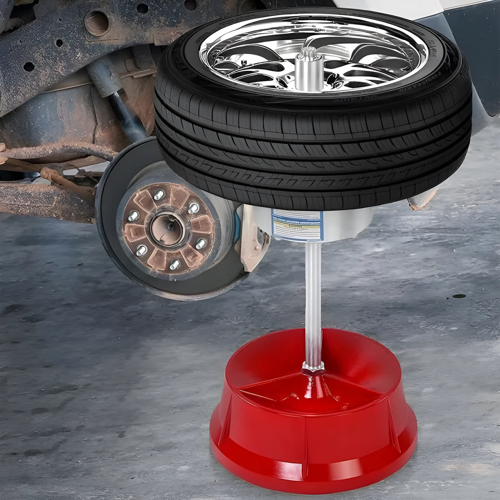 Portable aluminium hub tyre balancer with bull's eye level on enamel base.
