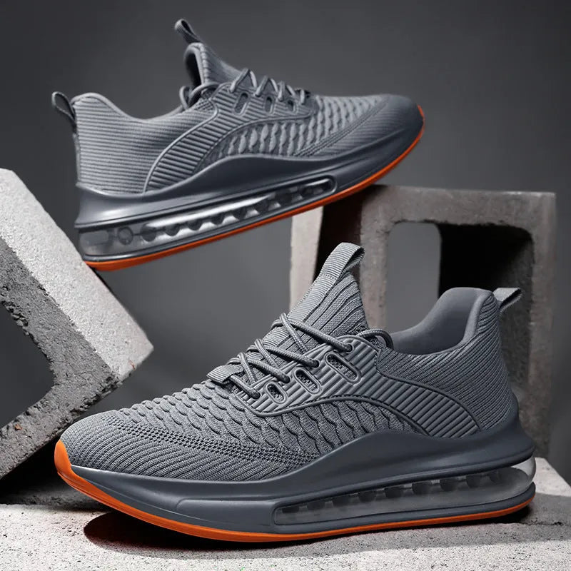 Men's low-top black mesh running sneakers with a round toe and lace-up front on a rubber sole.