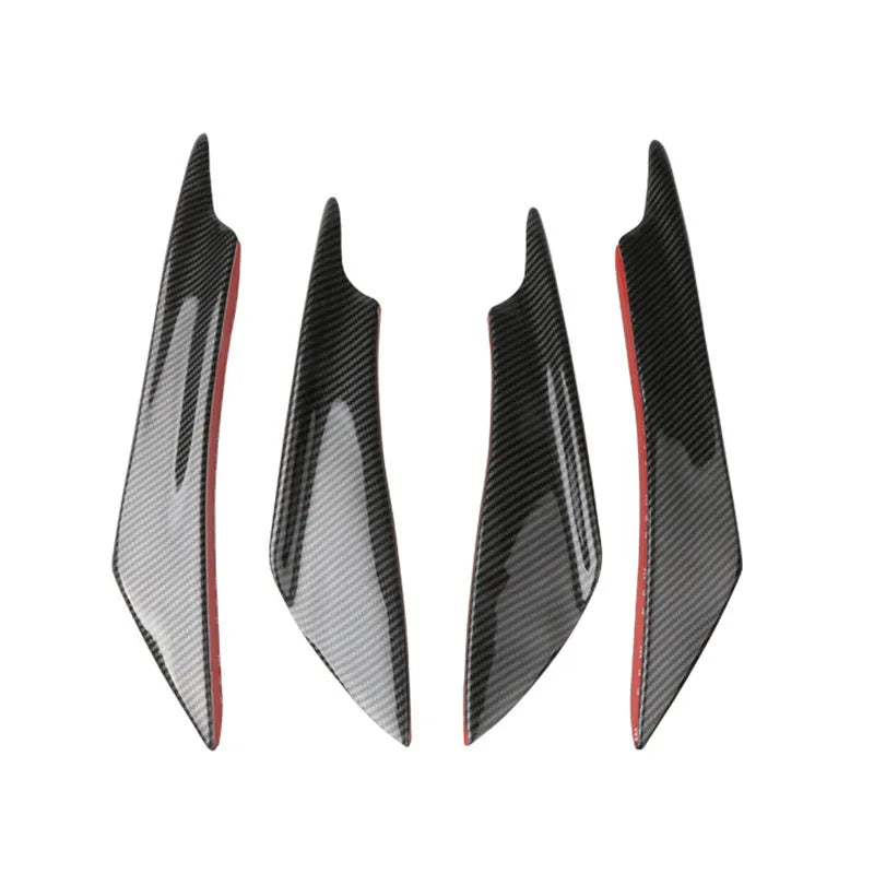 Set of four black ABS plastic bumper blade spoilers for car modification on a white background.