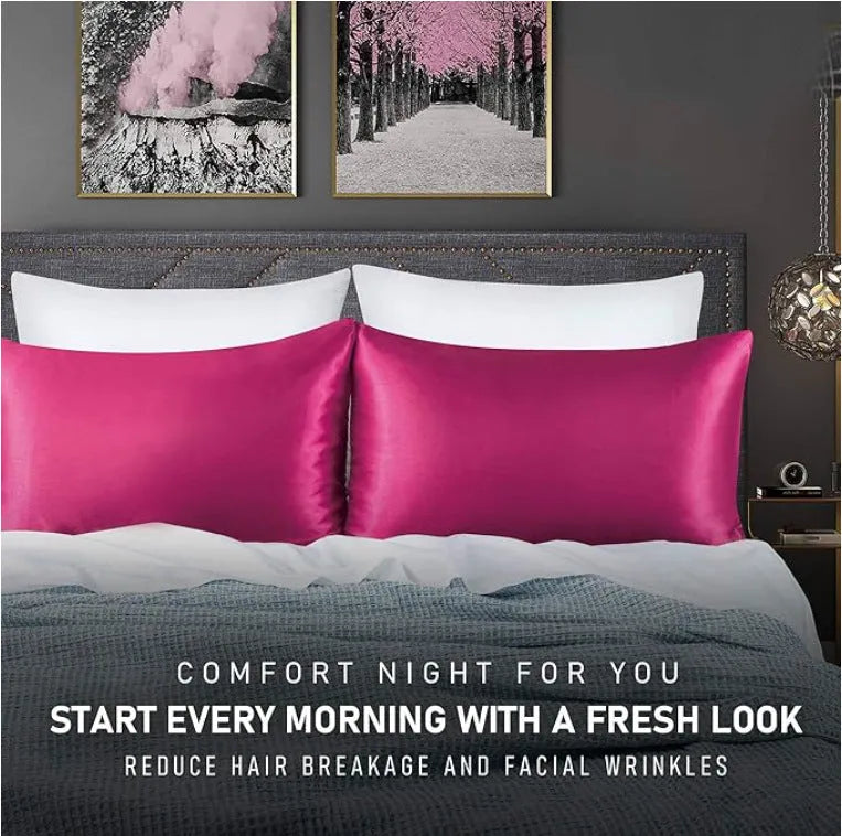 A pair of solid colour satin pillowcases in various colours and sizes on a bed.