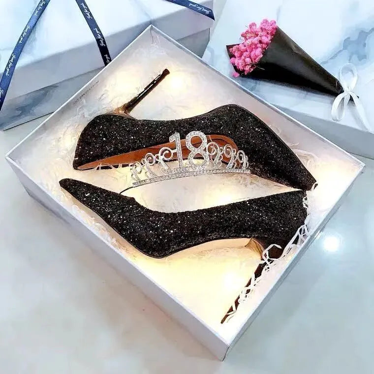 Women's silver and black crystal bridal shoes with stiletto and low heels on a size chart.