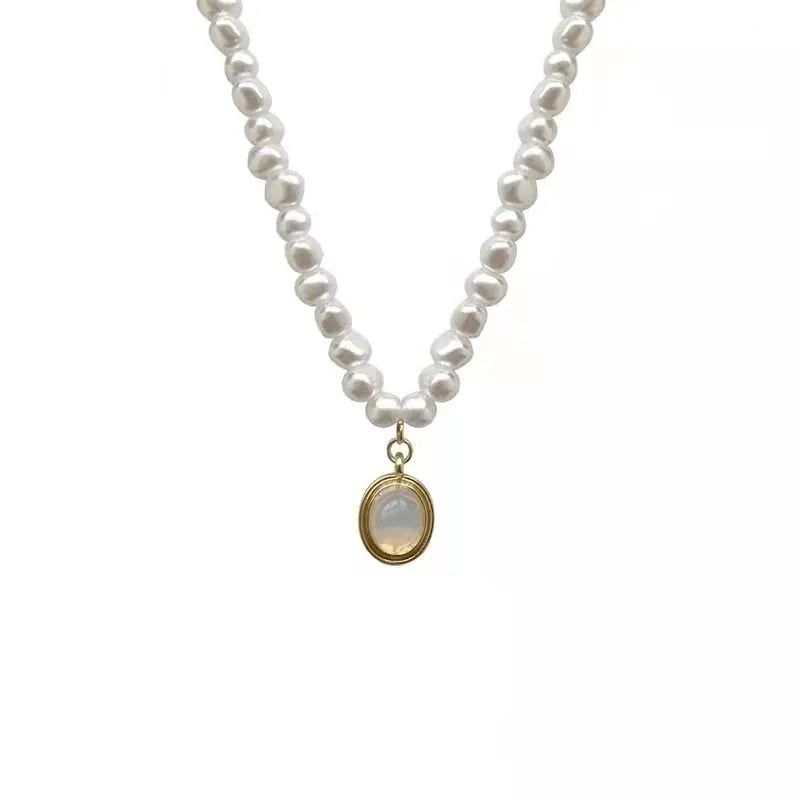 Adjustable French Court vintage style alloy necklace with geometric pendant and pearl details.