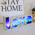Rainbow style LED LOVE light decoration with plastic shell measuring 35.5cm by 13.5cm