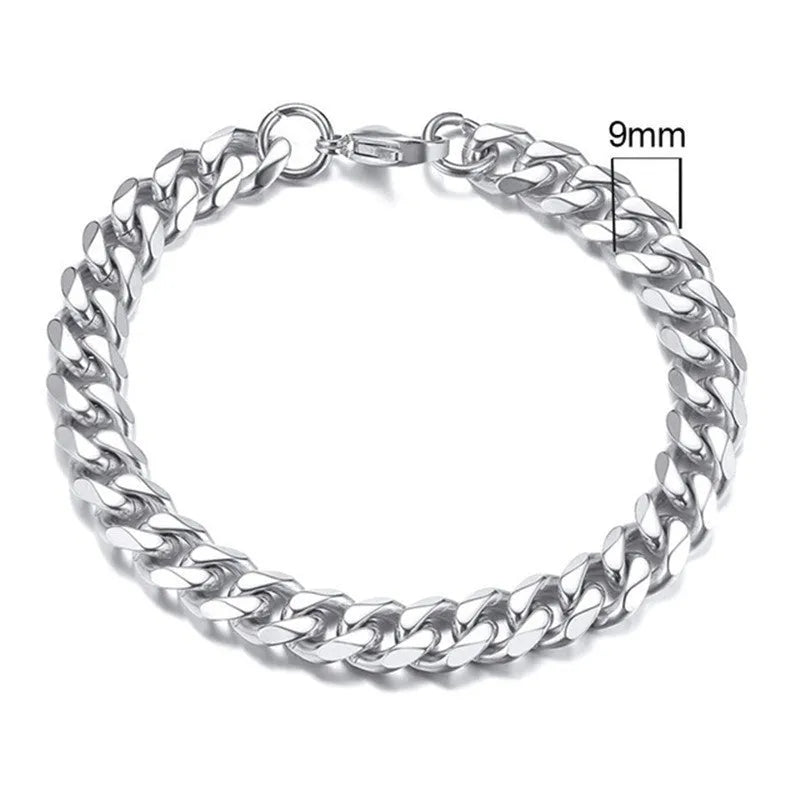 Six-sided geometric link metal bracelet in gold colour on a wrist.