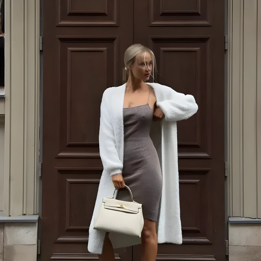 White women's sweater cardigan jacket with extended length and loose fit design