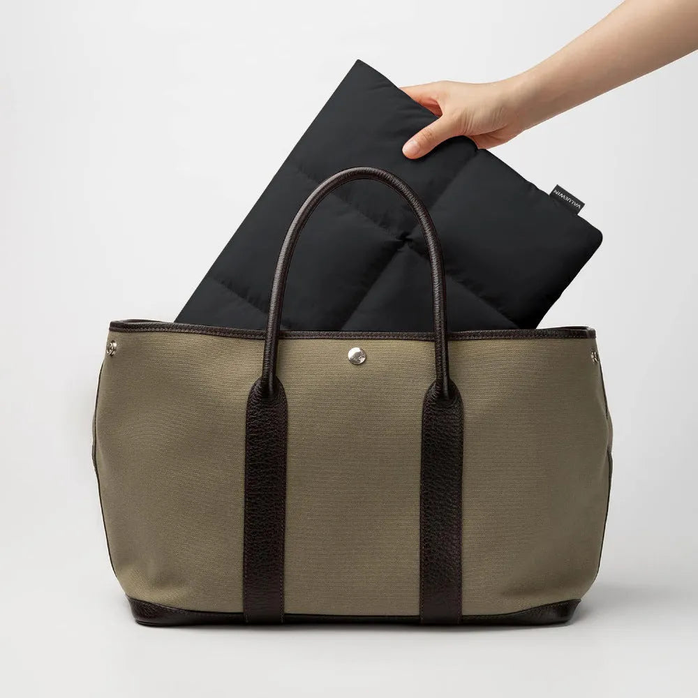 Soft fluffy polyester laptop sleeve in retro style with sewing thread detailing for 13 to 15.6 inch devices
