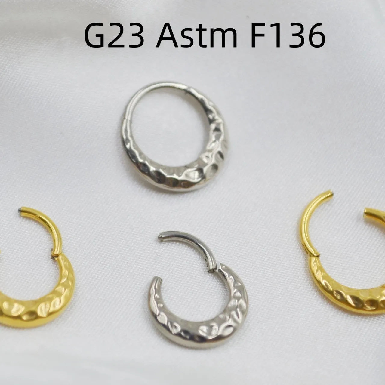 ASTM F136 titanium alloy nose ring with concave-convex carved design in gold or silver.