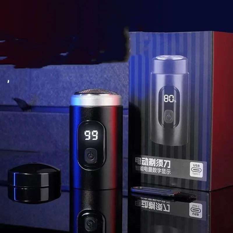 Black mini portable USB rechargeable electric shaver with cleaning brush and cable.