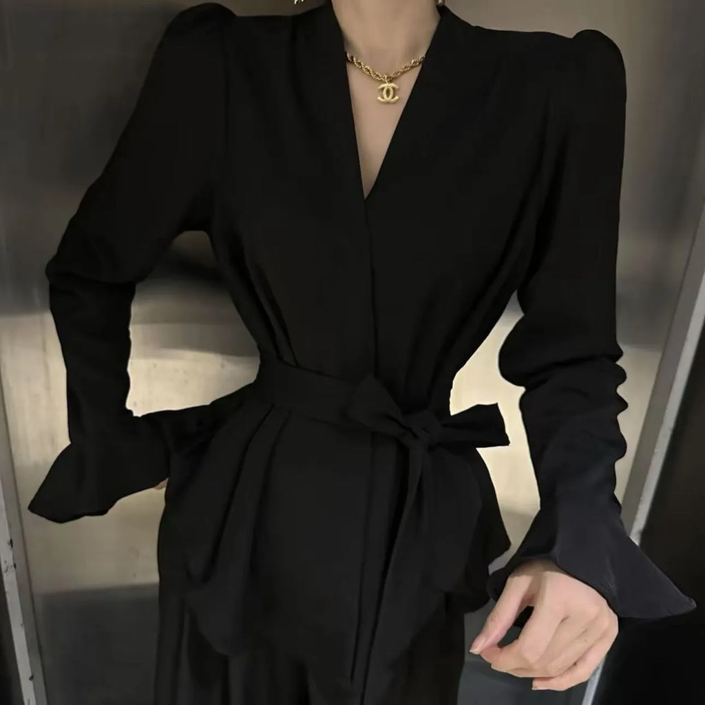 Women's French-style irregular collar long sleeve shirt with bell sleeves and a tie front.