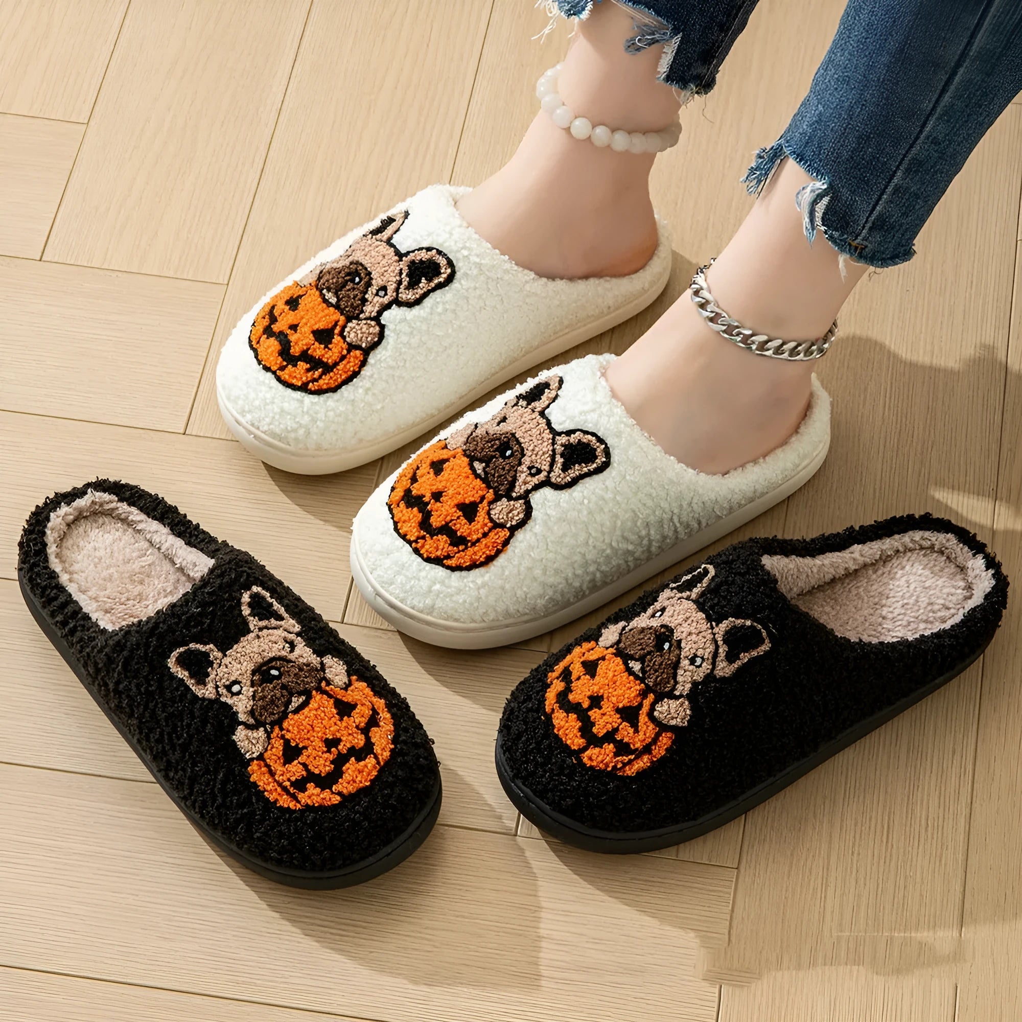 Halloween pumpkin slippers in black or white with plush material and rubber soles