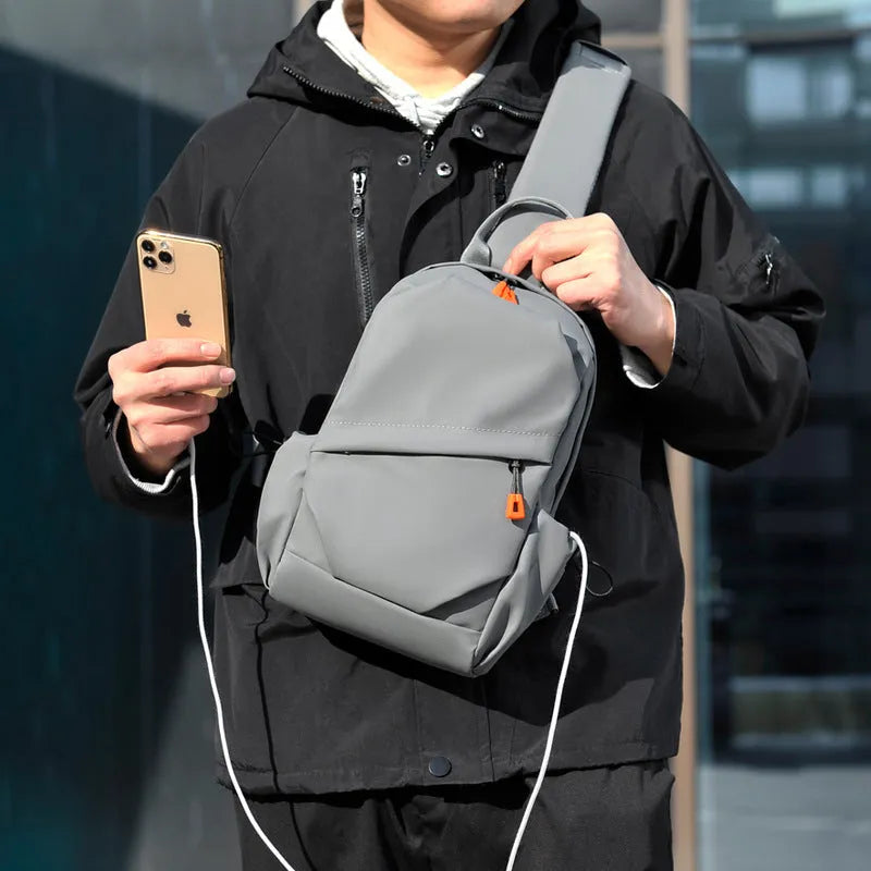 Men's black polyester crossbody bag showing single shoulder strap and simple design