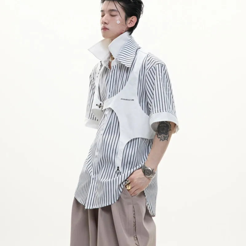 Man wearing a black and white striped cotton shirt with a distinctive double collar and short sleeves.