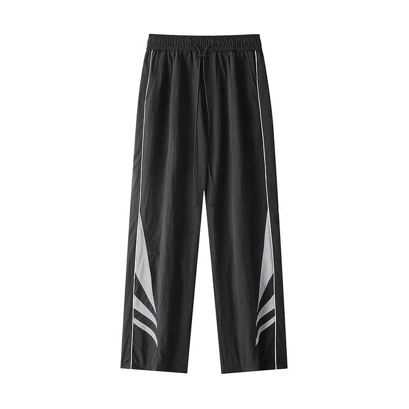 Men's straight cut casual trousers in black with elastic waistband and cardigan button detail