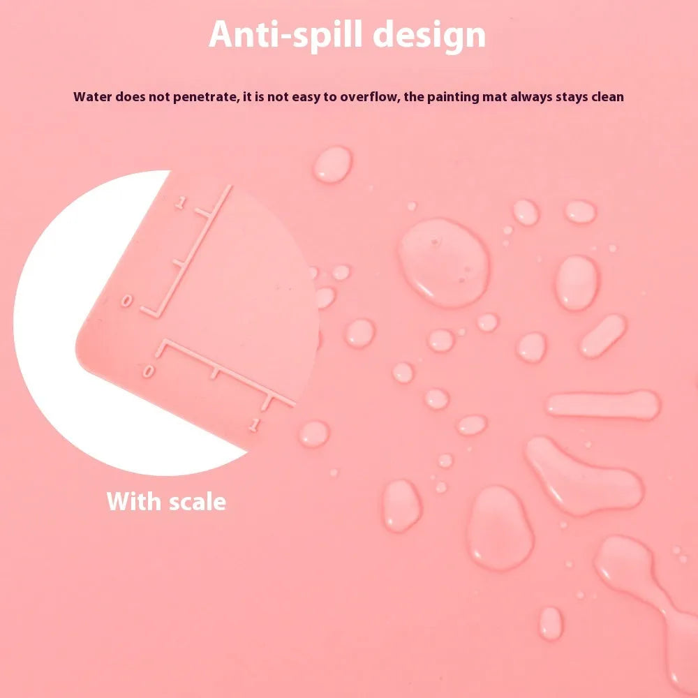 Light blue silicone painting mat with two round bowls on a 50cm by 40cm rectangular surface.