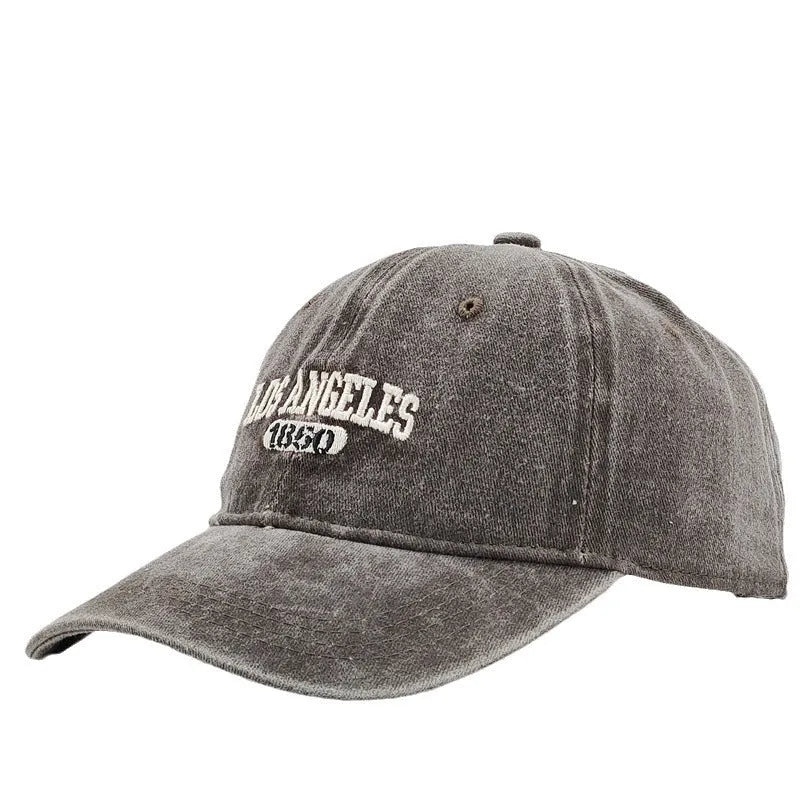 Retro adjustable peaked cap with distressed embroidery in conical crown design