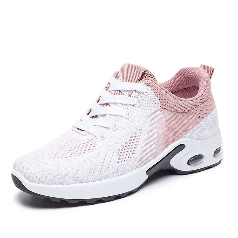 Women's pink Flyknit casual running shoes with mesh lining and flat heel on a white background
